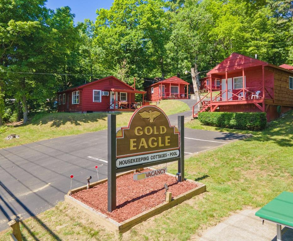 a sign in front of a sign in front of a house at The Gold Eagle in Lake George