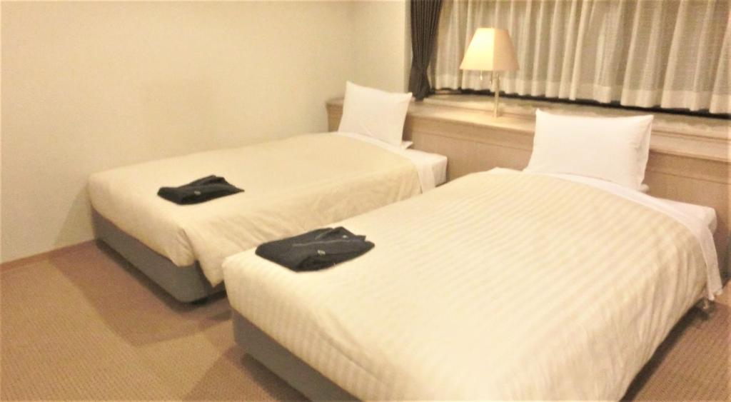 Postel nebo postele na pokoji v ubytování Hotel Cypress Karuizawa