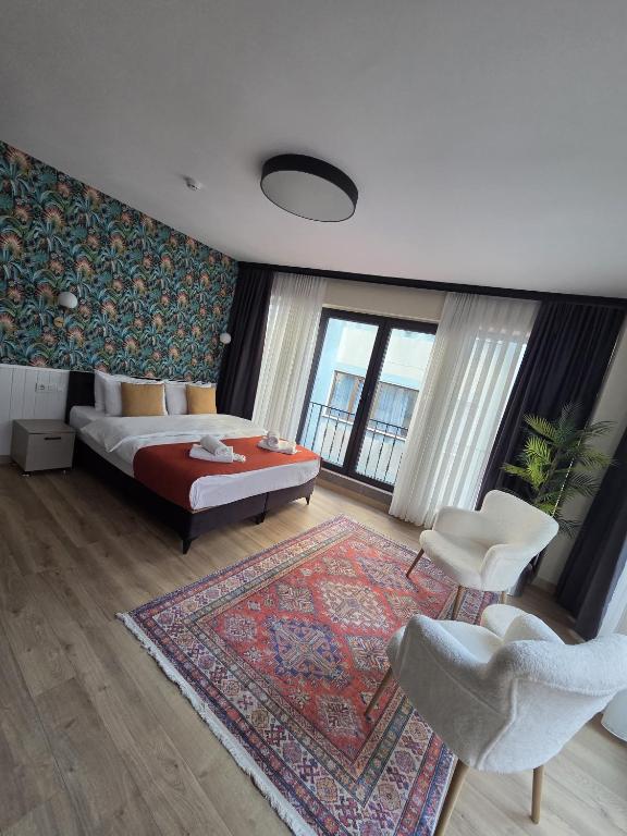 a bedroom with a bed and a rug at Zulu Suites in Istanbul