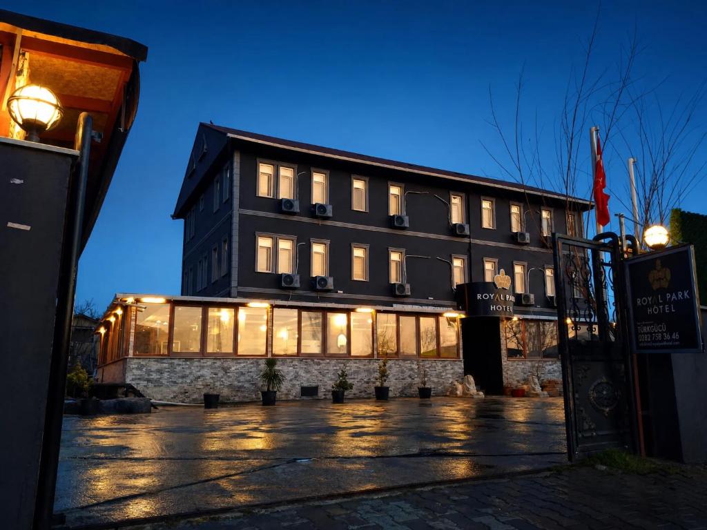 a building with lit up windows in front of it at Royal Park Hotel Corlu Bed and Breakfast in Tekirdağ
