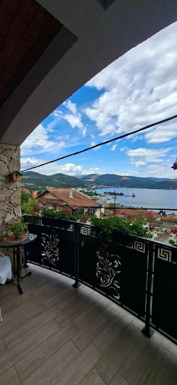 an outdoor balcony with a view of the ocean at Casa Cristyana in Orşova