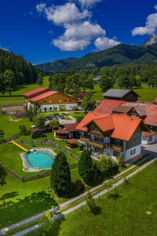 an aerial view of a resort with a swimming pool at Minzlhof in Ramsau am Dachstein