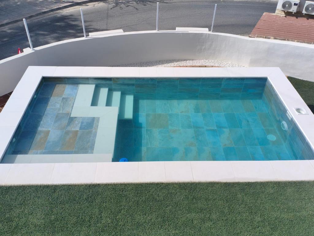 an overhead view of a swimming pool with a coping at Casas las Lanzas 1 in Setenil