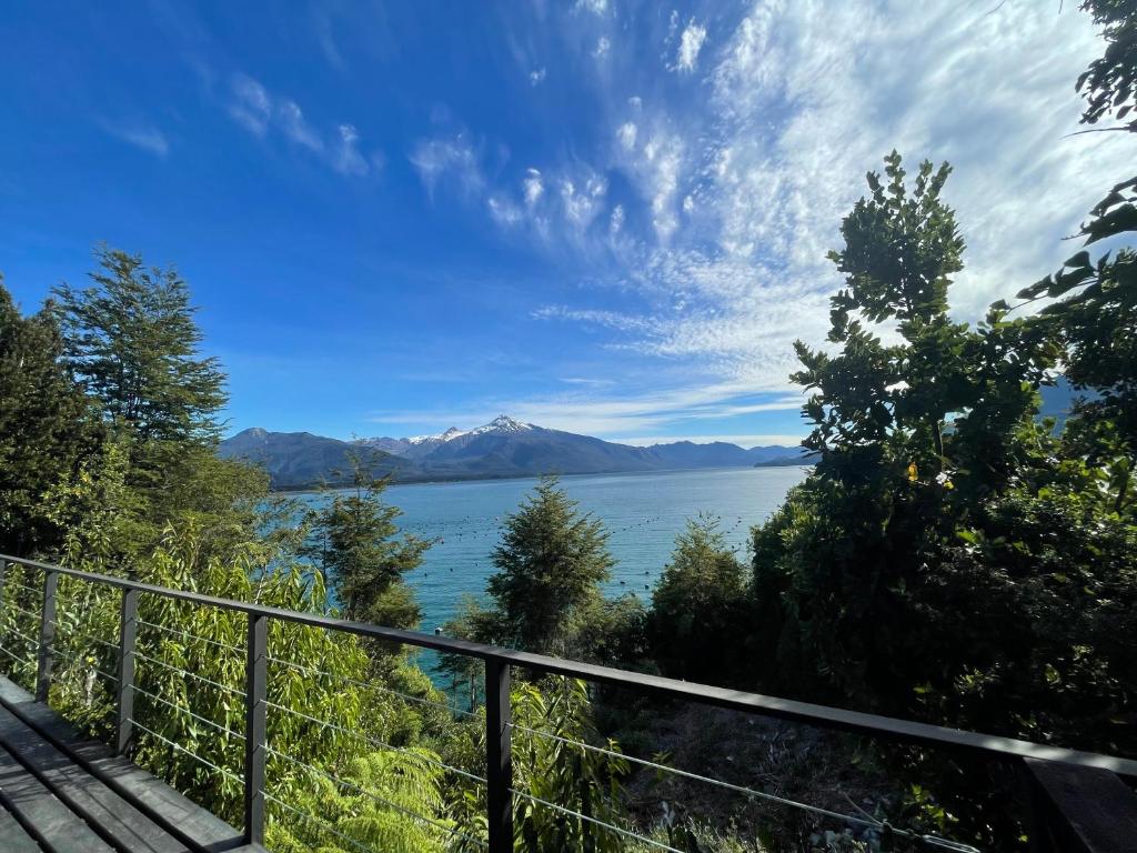 a view of a lake with mountains in the distance at Cabaña Puelo-Cochamó Tiny house in Sotomó