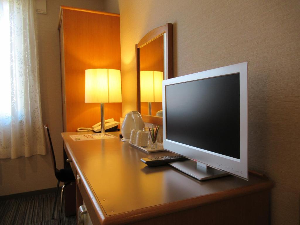 TV a/nebo společenská místnost v ubytování Center Hotel Mihara
