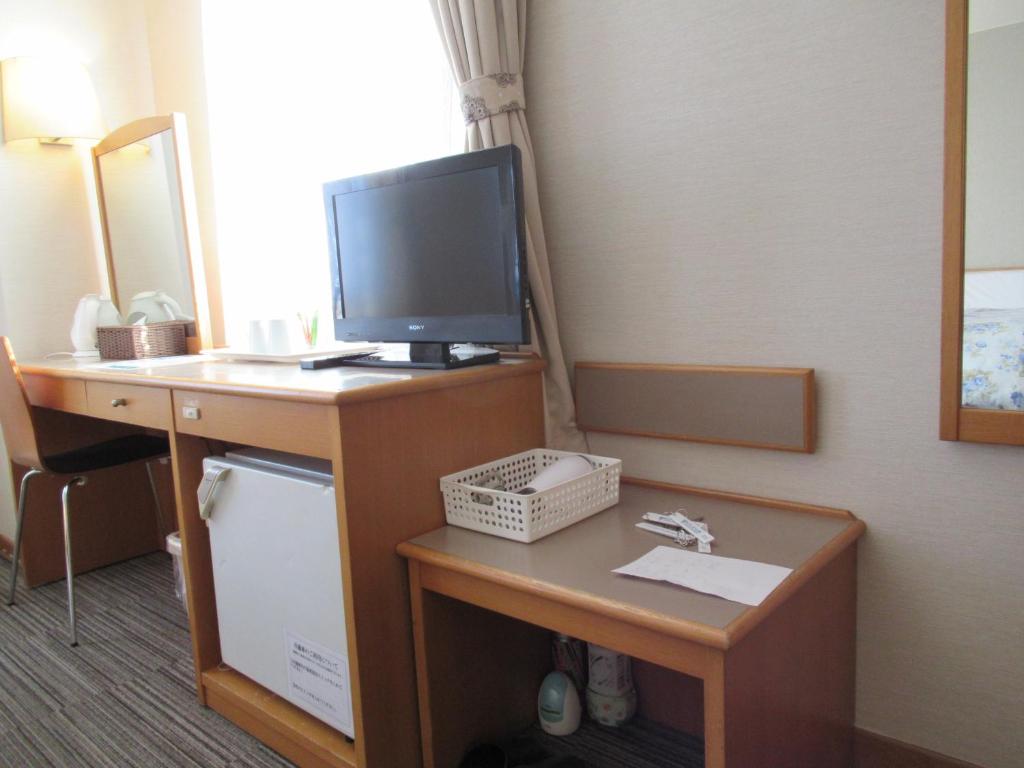 TV a/nebo společenská místnost v ubytování Center Hotel Mihara