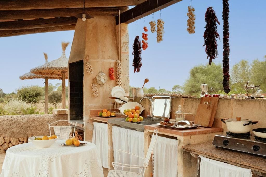 a kitchen with a table with fruit on the counter at La Molina Mallorca in Felanitx