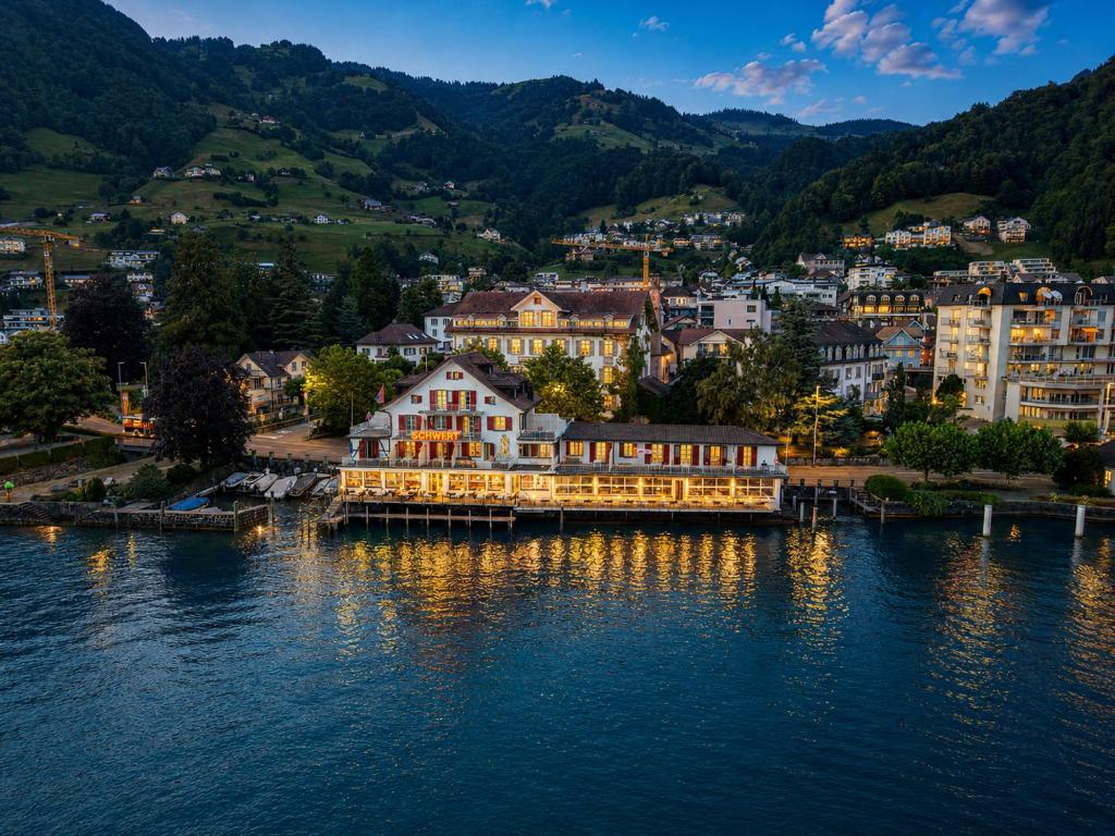 a view of a town on the water at Seehotel Schwert in Gersau