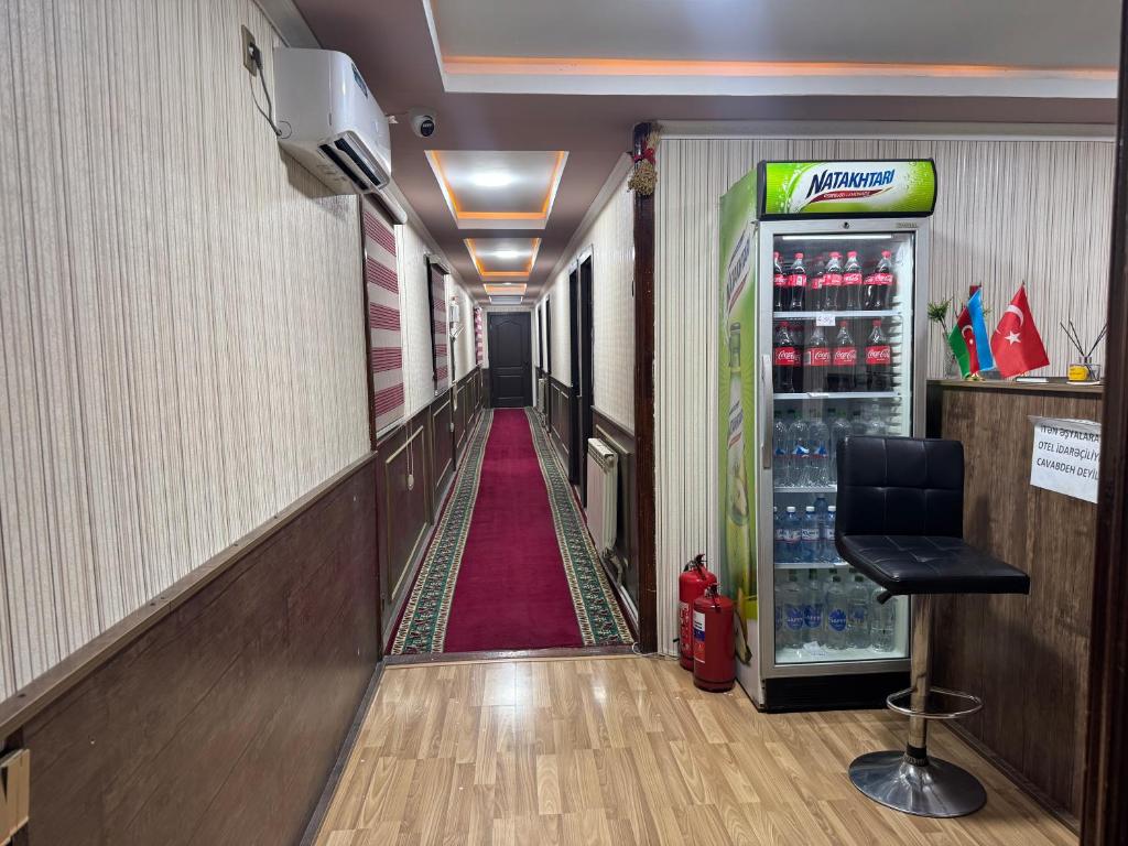 a long hallway with a soda machine in a store at Elit Hotel in Mingachevir