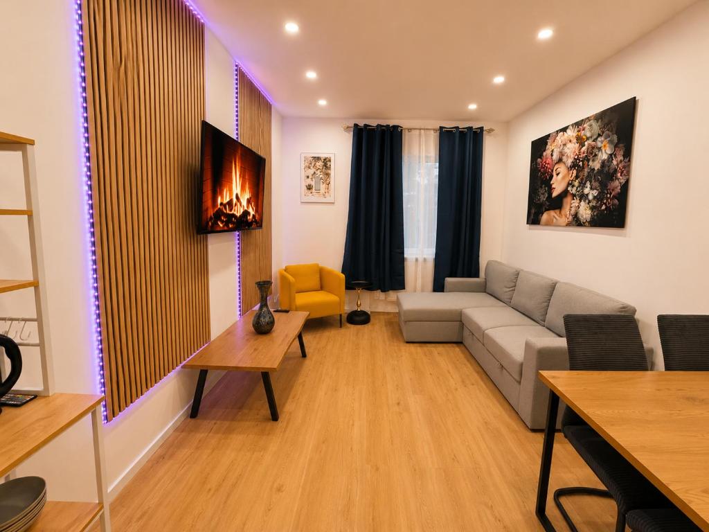 a living room with a couch and a table at City Line Koblenz in Koblenz