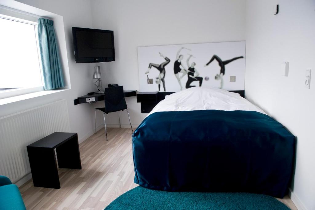 Postel nebo postele na pokoji v ubytování Hotel DGI-Huset Herning