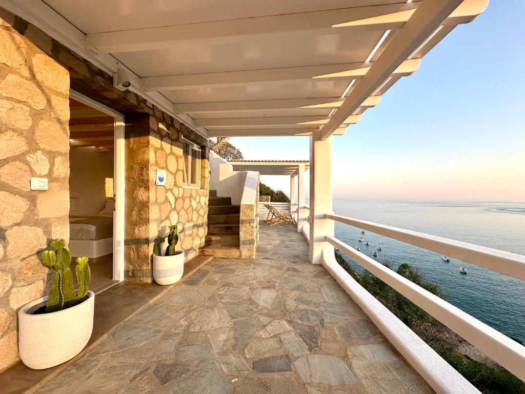 a balcony of a house with a view of the ocean at Sul Mare Suite in Agia Kiriaki Beach