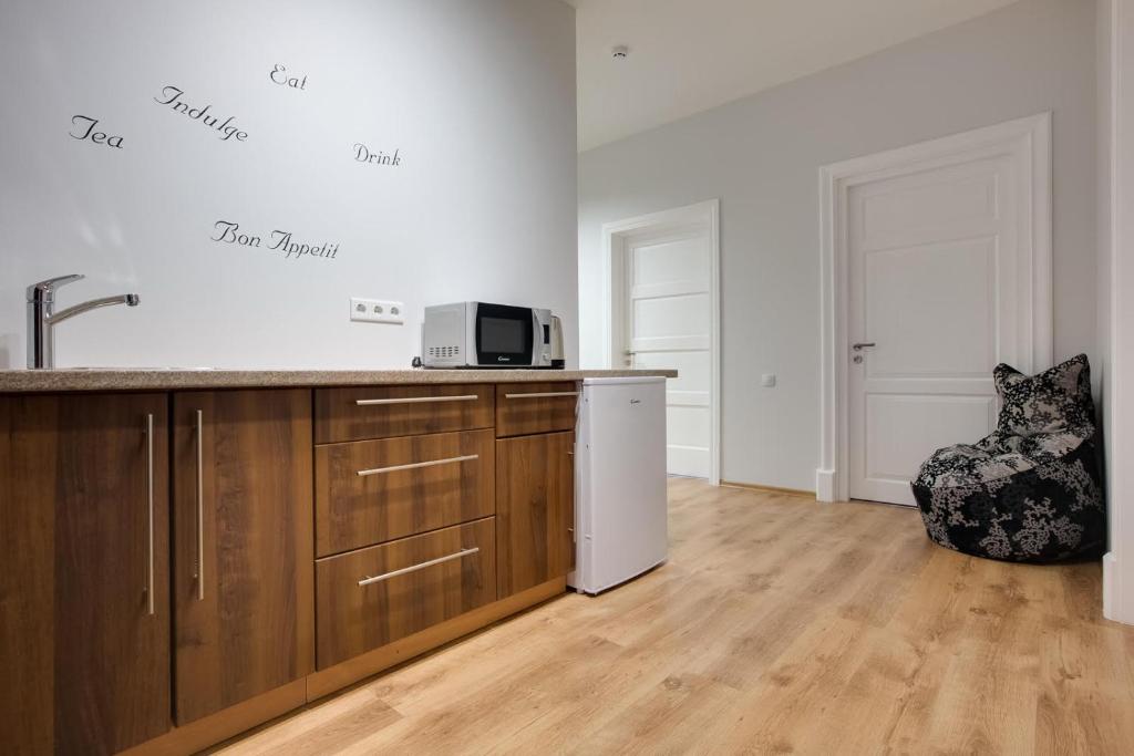 Kuchyň nebo kuchyňský kout v ubytování Orange Cat Rooms