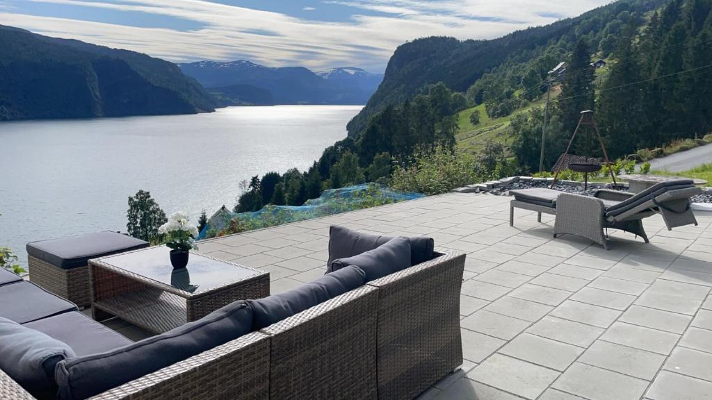 a patio with a view of a body of water at Stryn Panorama in Stryn