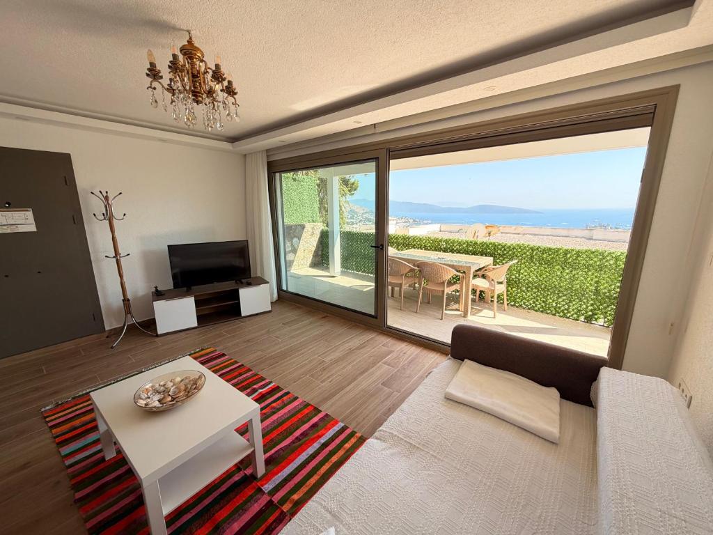a living room with a couch and a table at BODRUM BURCU RESIDENCE, Magnificent Sea View, Cozy, Free Otopark, Free Wifi in Bodrum City