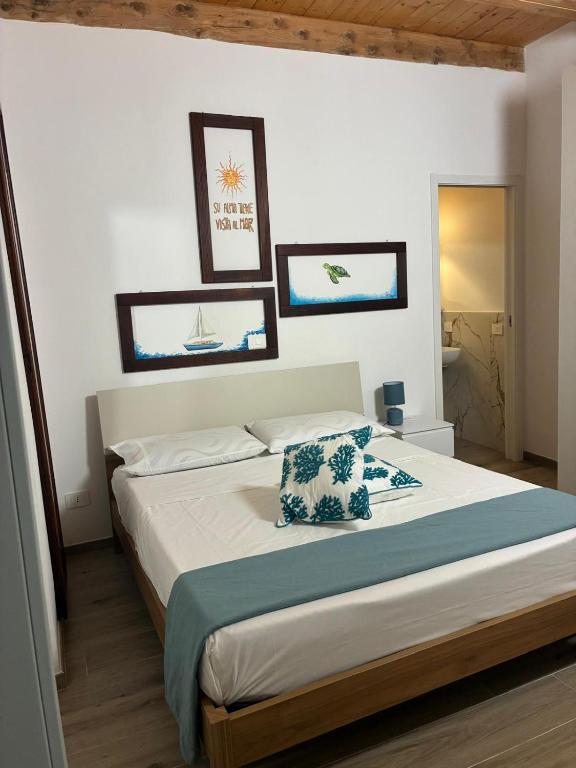 a bedroom with a bed with a pillow on it at Almarè in Grottammare