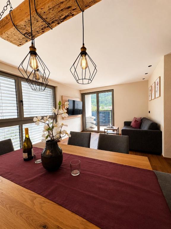 a living room with a table and a couch at NEU ab Juli 2026 - Apart Kneringer in Prutz