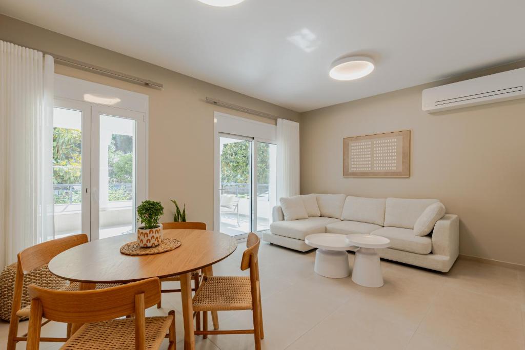a living room with a couch and a table at Anema Living in Parga