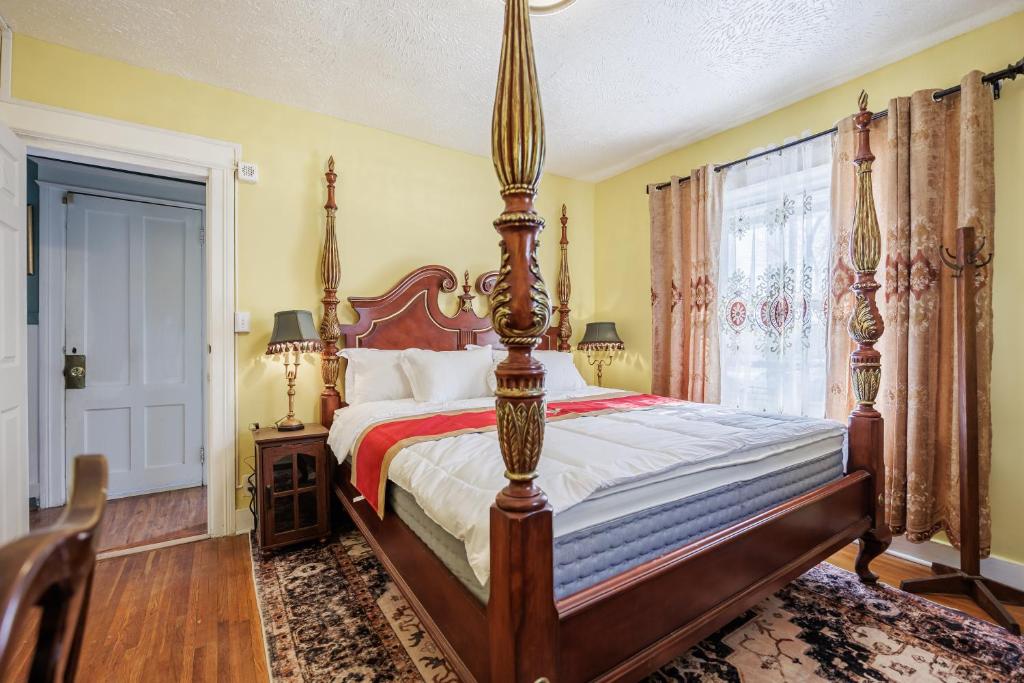 a bedroom with a large bed and a window at Room B1-Shared bathroom King Bed Washer Dryer in Rochester