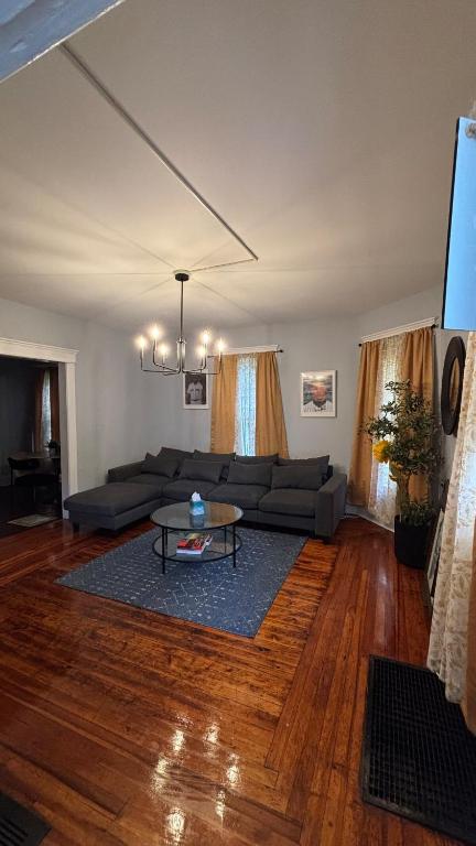 a living room with a couch and a table at Cozy Oneonta Getaway in Oneonta