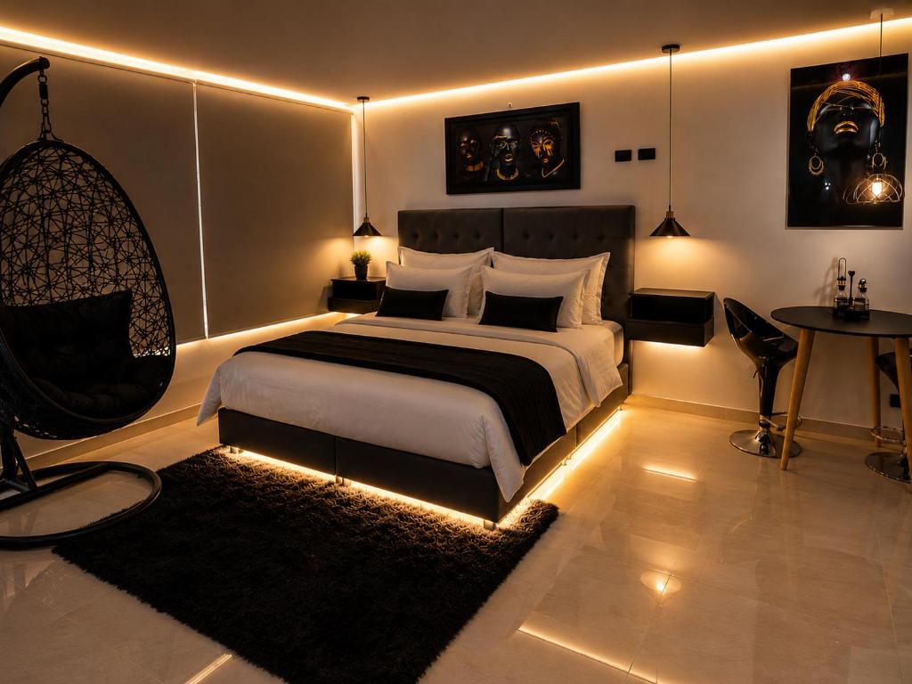 a bedroom with a bed with lights in it at Aparta Estudios Luz Galery in Bogotá