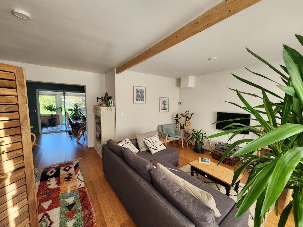 a living room with a couch and a table at Les ridens in Sangatte