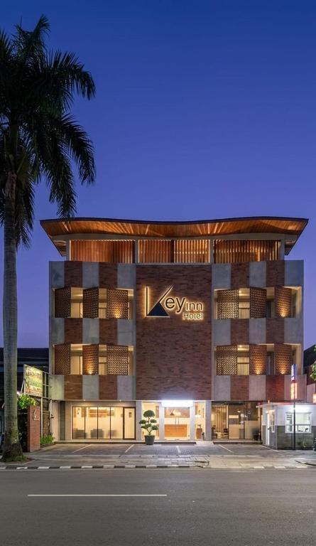 a building with a sign that reads exuma hotel at Key Inn Hotel Bogor in Kamparganya