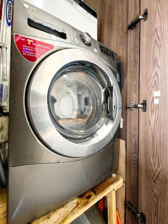 a washing machine is sitting on a shelf at Edificio Urban in Cajicá