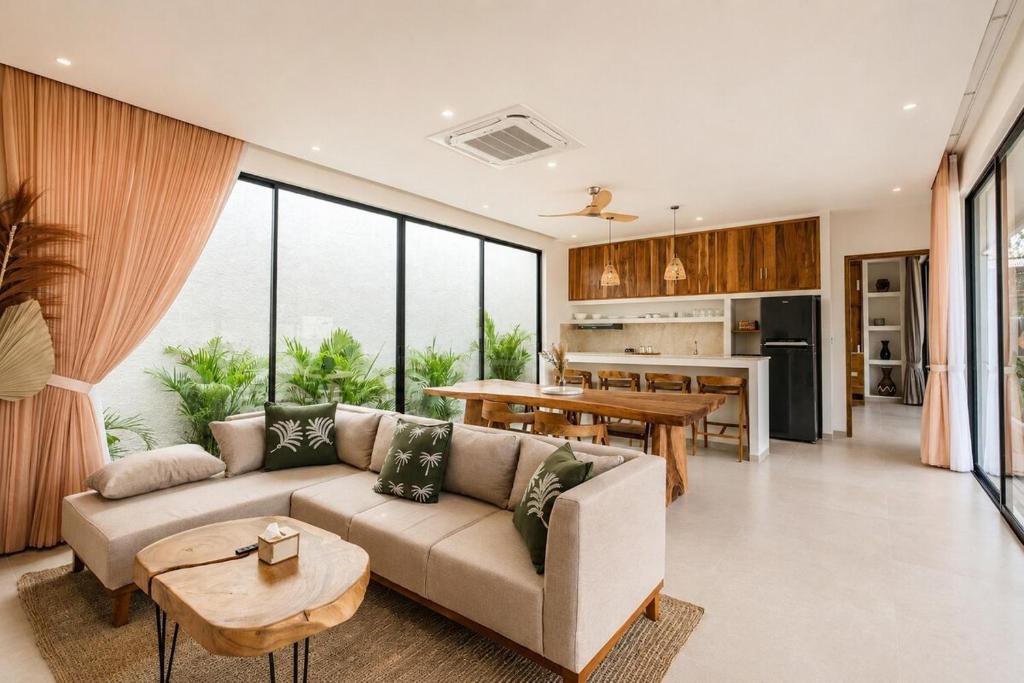 a living room with a couch and a table at Santo Villa Uluwatu in Bingin Beach