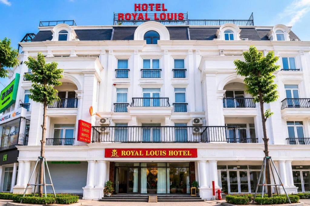 a white building with a hotel royal louis hotel at Royal Louis Hotel in Hanoi