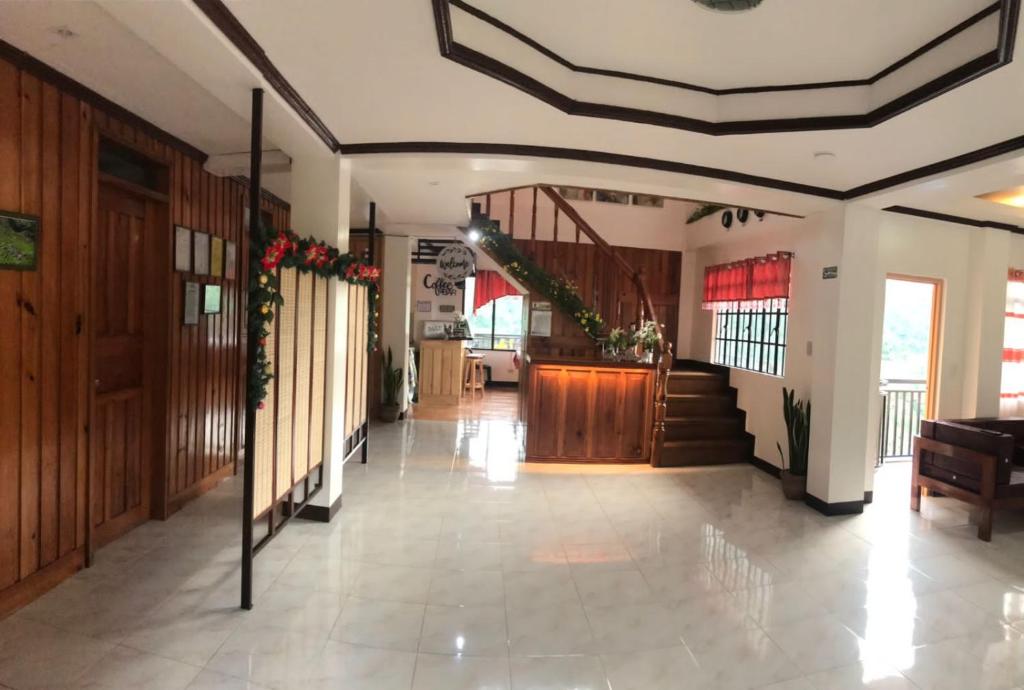 a hallway with a staircase in a building at The Verandah Lodge Bed and breakfast in Banaue