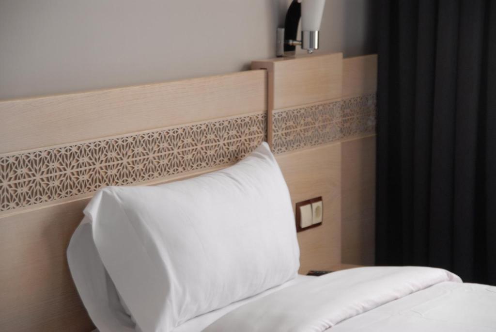 Voodi või voodid majutusasutuse Hotel A44 toas