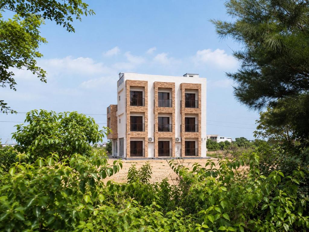 an abandoned building with trees in front of it at Hai Jing Man Lu B&B in An-hsia
