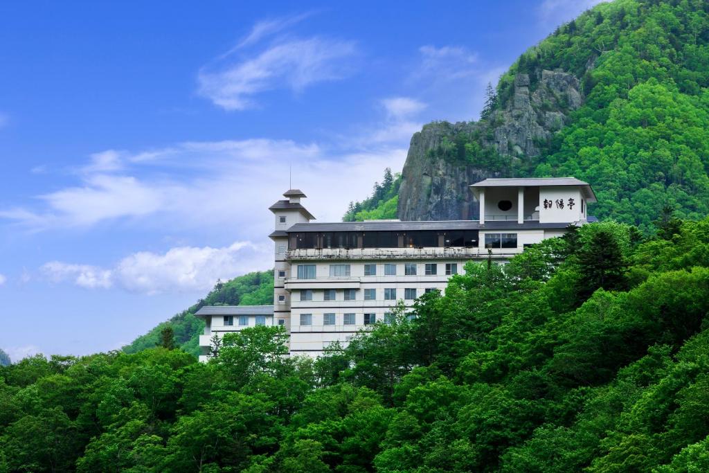 a building on the side of a mountain at Choyo Tei in Kamikawa