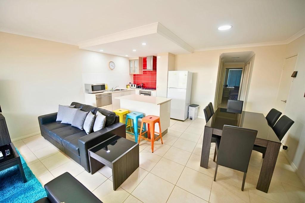 a living room with a couch and a table at Midland Haven - Midland WA in Midland Junction