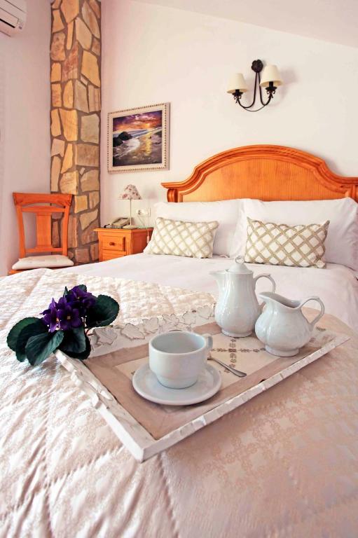 Postel nebo postele na pokoji v ubytování Hotel Casa Rosa