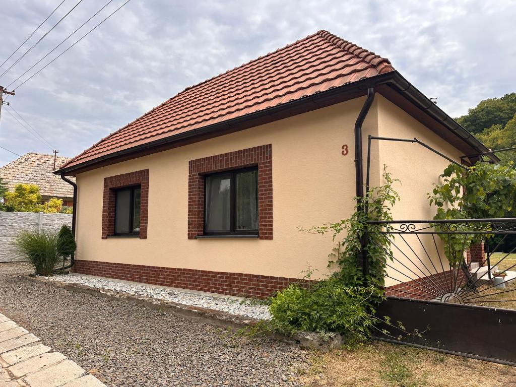 a small house with a red roof at Ubytovanie Lišov 3 - Vidiecky dom in Lišov