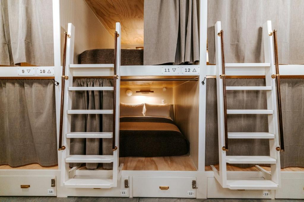 two bunk beds in a room with a bed at Cache House in Jackson