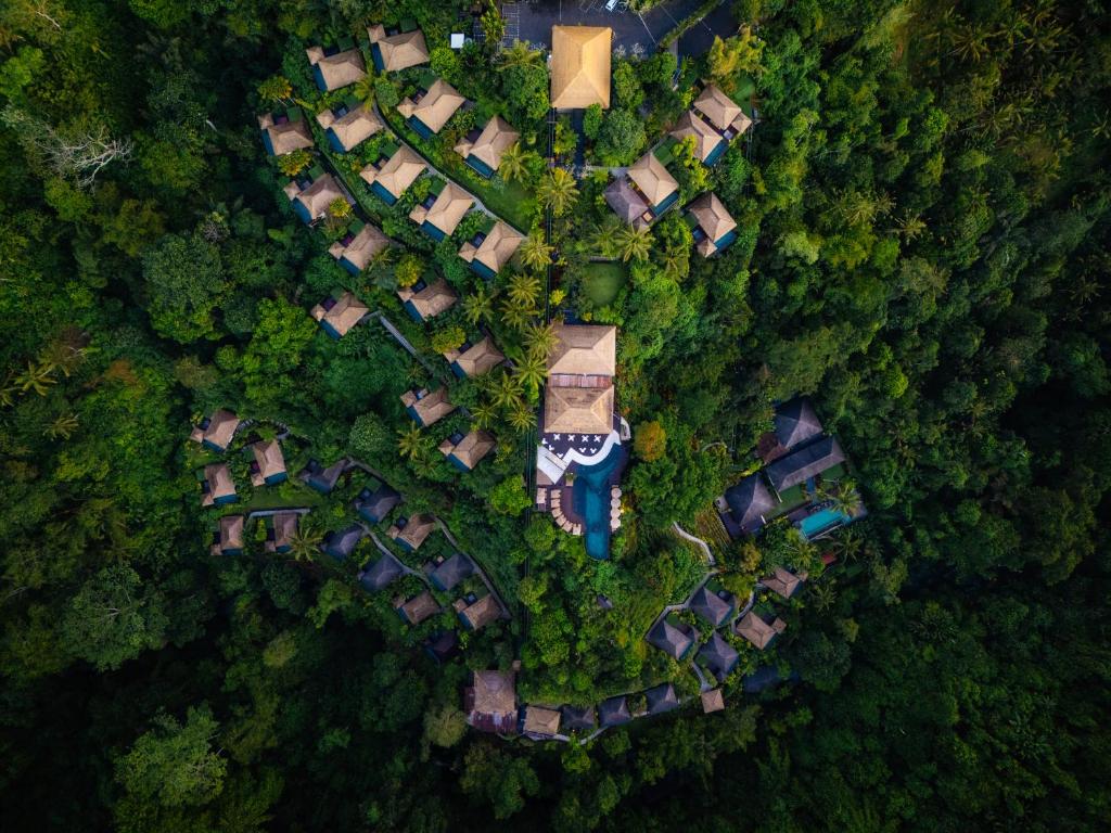 an overhead view of a group of houses in a forest at Hanging Gardens of Bali in Payangan
