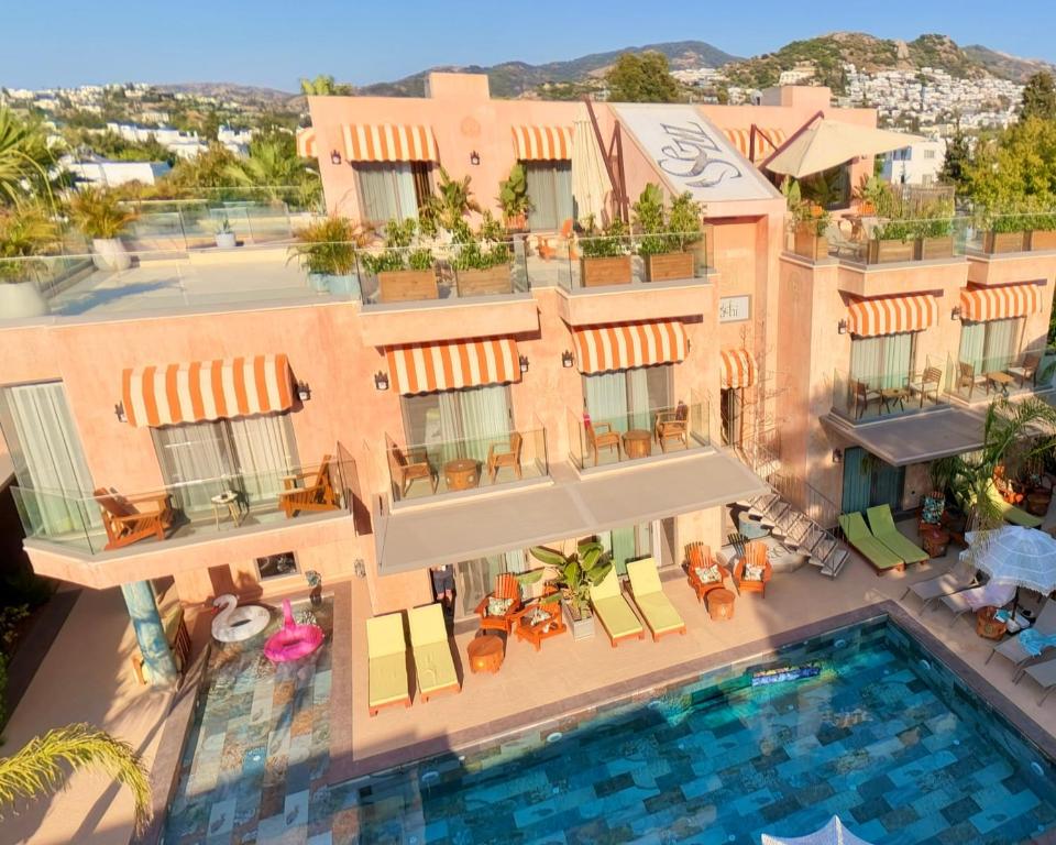 an aerial view of a hotel with a swimming pool at Sezz Hotels Spa Wellness Yalikavak Adult Only in Yalıkavak