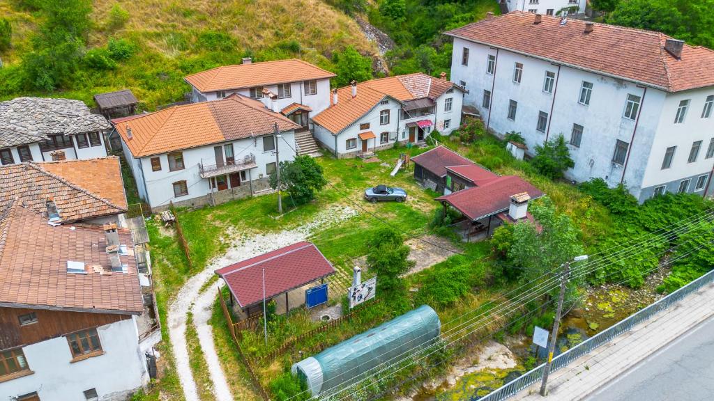 an aerial view of a town with houses and a train at Кампинг Петлето in Sokolovtsi