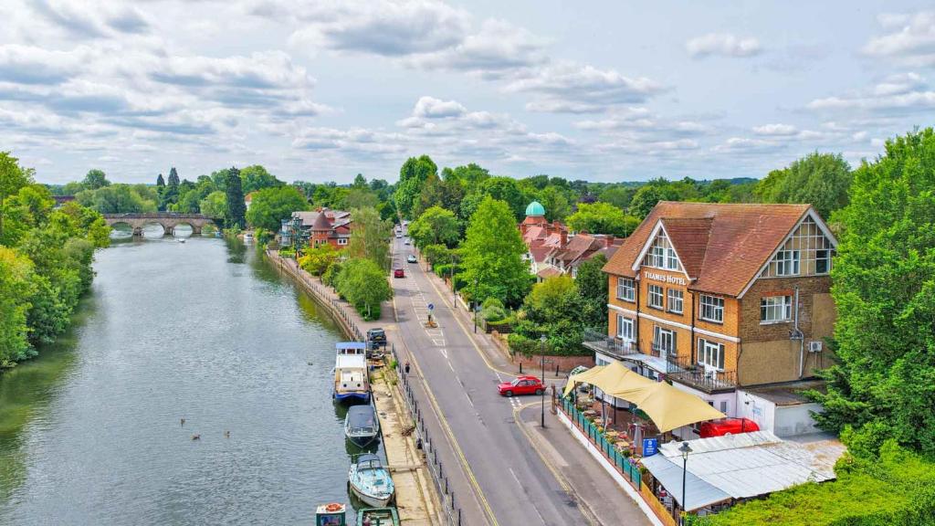 an aerial view of a town with a river at Uno Thames Hotel -Reopened Brand New Again -FREE PARKING in Maidenhead