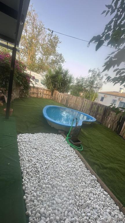 a swimming pool in the middle of a yard at La Casita in Seville