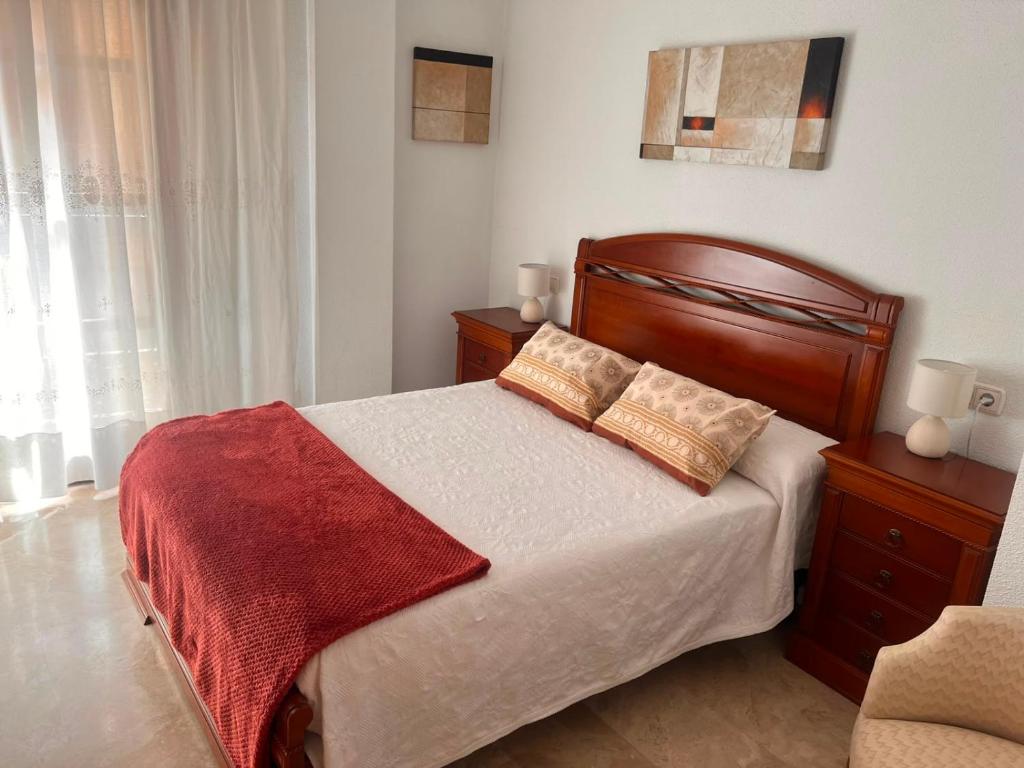 a bedroom with a bed with two pillows on it at Aurora in Teruel