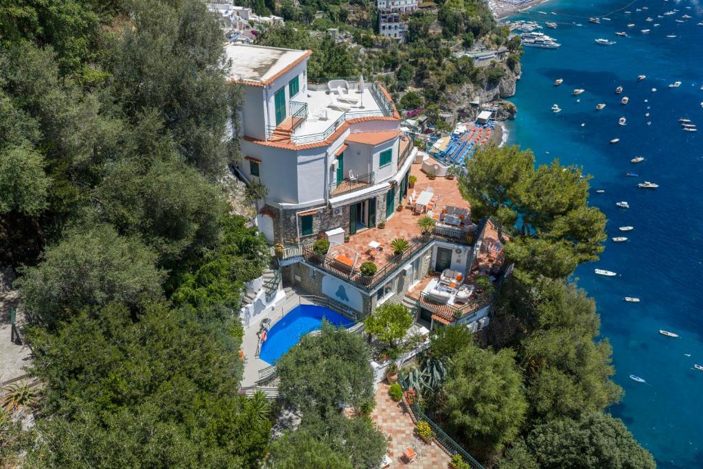 an aerial view of a large house on the water at Luxury Villas Positano in Positano