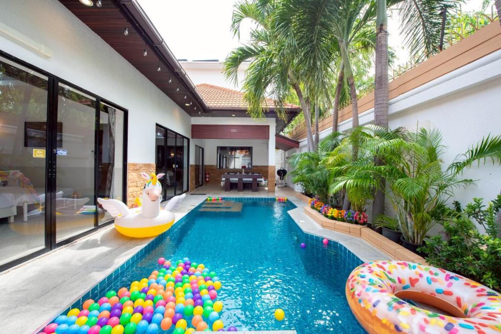 a pool with a lot of balls in a house at MM Pool Villa in Pattaya South