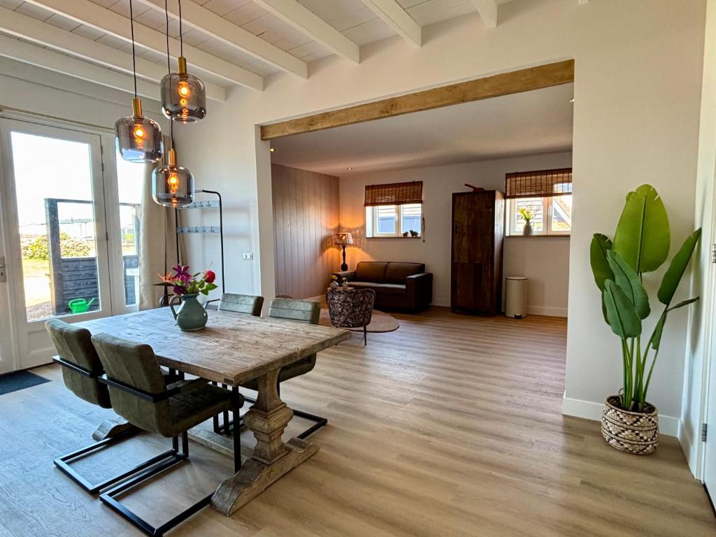 a living room with a table and a couch at Sea Cottage in Westerland
