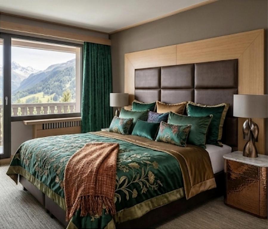 a bedroom with a large bed with a large window at Le Cocon des 2 Alpes, Spa, Jacuzzi, Piscine Chauffee in Les Deux Alpes