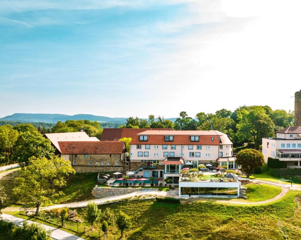 an aerial view of a resort with a building at Burghotel Staufeneck in Salach