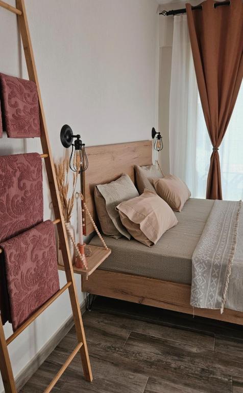 a bedroom with a bunk bed with a ladder at Marivar living in Nea Fokea
